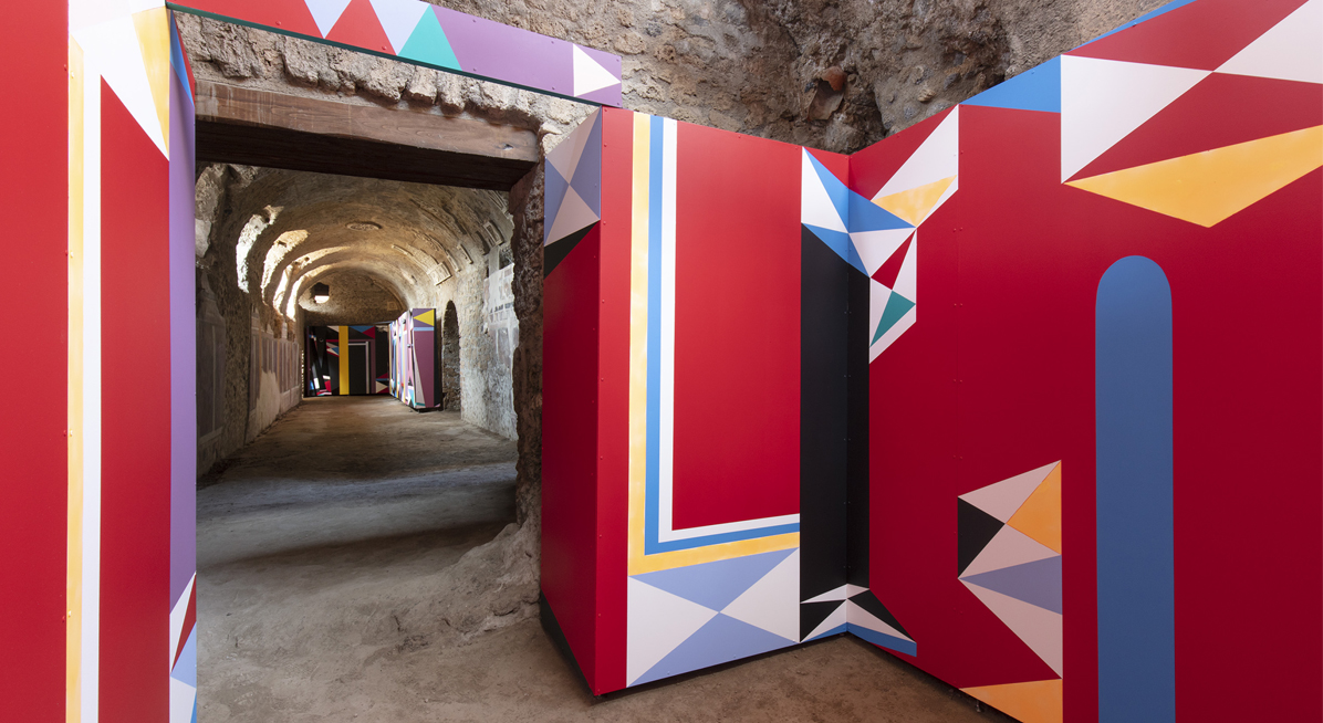 Interior of ancient building with abstract artwork cladding the walls 